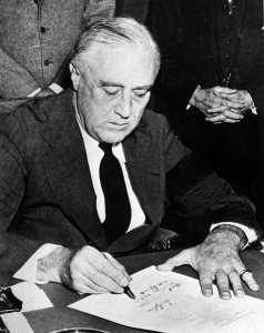 477px-Franklin_Roosevelt_signing_declaration_of_war_against_Japan