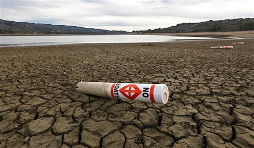 A warning buoy sits on the dry, cracked bed of Lake Mendocino near Ukiah, California. (AP Photo/Rich Pedroncelli, File)