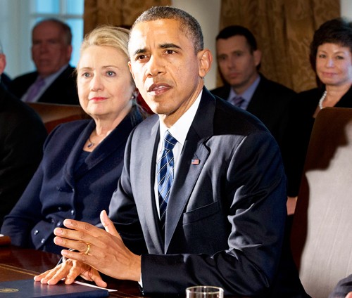  This Nov. 28, 2012 file photo shows then-Secretary of State Hillary Rodham Clinton listening as President Barack Obama speaks in the Cabinet Room at the White House in Washington. (AP Photo/Jacquelyn Martin, File)