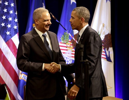 Barack Obama and U.S. Attorney General Eric Holder at Holder’s portrait unveiling ceremony, Department of Justice, Washington DC—Feb. 27, 2015 (Rex Features via AP Images)