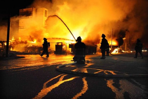 Image #: 36434158    Baltimore firefighters battle a three-alarm fire at Gay and Chester Streets on Monday, April 27, 2015, in Baltimore. It was unclear whether it was related to ongoing riots. (Jerry Jackson/Baltimore Sun/TNS) 